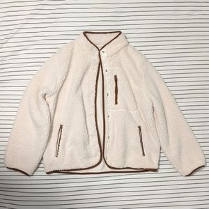 Ivory Sherpa jacket with brown trim